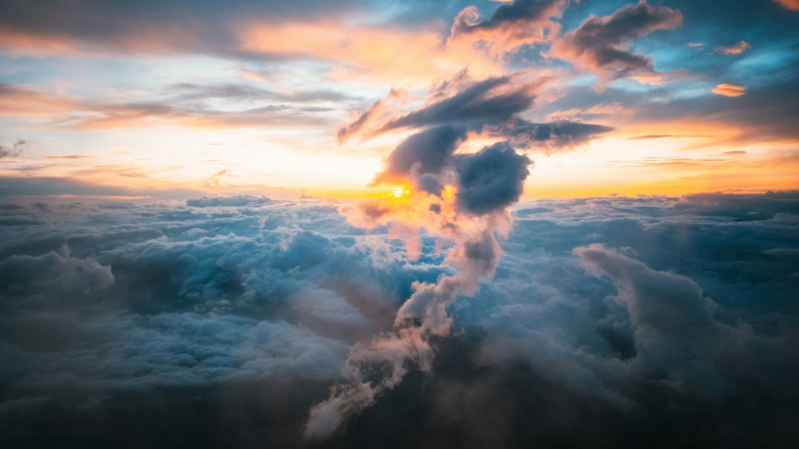 white clouds under orange sky